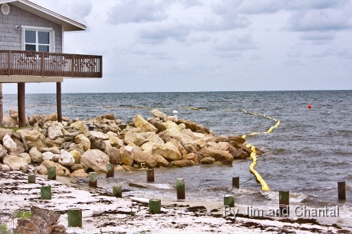  Beach house and boom deployed for BP oil spill. Alligator Point: .