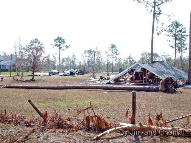  Home and vehicle damage west of Waveland, Mississippi.   On Pearlington Rd. 2 mi west of Lakeshore Rd.