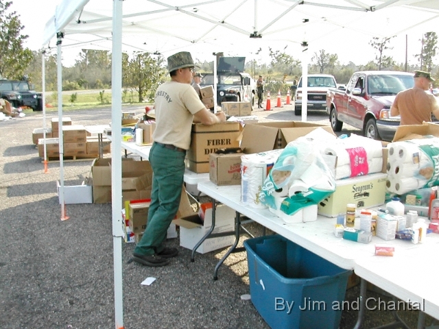  Fla. Div. of Forestry and Ohio Nat'l Guard 838th MP Co.   distribute FEMA water, ice, and MREs to victims of   Hurricane Katrina at POD 58, Necaise, Mississippi.