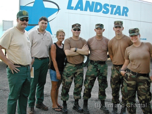  Local coordinator Deanie Necaise (3rd left), Florida  Div.   of Forestry and Ohio 838th MP Company distribute   hurricane Katrina relief at Amer. Legion Post 58 in   Hancock County, Mississippi, with communications   support by Florida amateur radio operators.